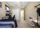 Bedroom with carpet, ceiling fan and shelving system, bed and sports decor at 20959 W Western Dr, Buckeye, AZ 85396