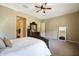 This bedroom features neutral walls, soft carpet, and an elegant wood dresser with mirror at 20959 W Western Dr, Buckeye, AZ 85396