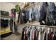 Walk-in closet features two levels of hanging space and built in shelving for organization at 20959 W Western Dr, Buckeye, AZ 85396