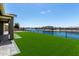 Artificial grass backyard and waterfront view at 22386 N Daniel Dr, Maricopa, AZ 85138