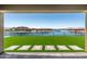 Captivating backyard with turf and water view, perfect for relaxing and entertaining guests at 22386 N Daniel Dr, Maricopa, AZ 85138