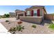 Cozy single-Gathering home featuring desert landscaping, providing a peaceful outdoor space at 22386 N Daniel Dr, Maricopa, AZ 85138