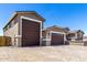 Spacious three car garage and paved driveway, offering ample parking at 22386 N Daniel Dr, Maricopa, AZ 85138
