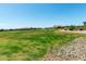 Expansive grassy area perfect for outdoor activities and recreation at 22386 N Daniel Dr, Maricopa, AZ 85138