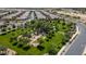 Aerial view showcasing a grassy park with playground, walking paths, trees and residential neighborhood in the background at 22601 E Via Las Brisas --, Queen Creek, AZ 85142