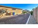The property boasts a neat and tidy backyard with gravel landscaping, a small pergola and a well maintained exterior at 22601 E Via Las Brisas --, Queen Creek, AZ 85142