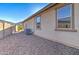 View of the side yard with desert landscaping, an AC unit and windows at 22601 E Via Las Brisas --, Queen Creek, AZ 85142