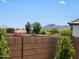 Beautiful backyard view showcasing a block fence and lush trees with mountains in the distance at 22601 E Via Las Brisas --, Queen Creek, AZ 85142