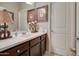 Guest bathroom with single sink, decorative accents, and framed artwork on display at 22601 E Via Las Brisas --, Queen Creek, AZ 85142