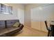 Bedroom featuring a sleeper sofa, a desk, and sliding-door closet at 22601 E Via Las Brisas --, Queen Creek, AZ 85142