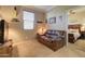 Cozy bedroom featuring a leather sofa and decorative wall art at 22601 E Via Las Brisas --, Queen Creek, AZ 85142