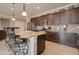 Gourmet kitchen featuring granite countertops, stainless steel appliances, and a breakfast bar at 22601 E Via Las Brisas --, Queen Creek, AZ 85142