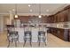 Gourmet kitchen featuring granite countertops, stainless steel appliances, and a breakfast bar at 22601 E Via Las Brisas --, Queen Creek, AZ 85142