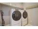 Well-equipped laundry room with a front-load washer and dryer at 22601 E Via Las Brisas --, Queen Creek, AZ 85142