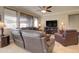 A comfortable living room featuring a plush leather sectional and a fireplace at 22601 E Via Las Brisas --, Queen Creek, AZ 85142
