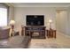 Comfortable living room with a fireplace, TV, and a plush leather sectional at 22601 E Via Las Brisas --, Queen Creek, AZ 85142