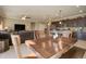 Open concept living space combining kitchen, dining area and living room with leather furniture at 22601 E Via Las Brisas --, Queen Creek, AZ 85142
