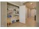 Walk-in pantry with ample shelving for food and storage, adjacent to hallway at 22601 E Via Las Brisas --, Queen Creek, AZ 85142