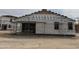 House under construction with exterior sheathing and scaffolding at 24072 W Bowker St, Buckeye, AZ 85326