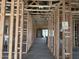 Interior view of the house showcasing exposed framing, electrical wiring, and the layout of the rooms at 24072 W Bowker St, Buckeye, AZ 85326