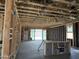 Open concept living area in construction with access to backyard and rough-in plumbing for a wet bar at 24072 W Bowker St, Buckeye, AZ 85326