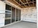 Covered patio under construction with large sliding glass doors at 24072 W Bowker St, Buckeye, AZ 85326