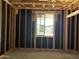 Framing and insulation for future window installation, indicating an energy-efficient build at 24072 W Bowker St, Buckeye, AZ 85326