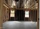 Spacious room construction highlighting the building progress, with framing and wiring in place at 24072 W Bowker St, Buckeye, AZ 85326