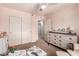 Pink Bedroom featuring a dresser, closet and plush toys, offering a cheerful and functional space for a  at 2435 N Riley Rd, Buckeye, AZ 85396