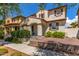 Charming two-story home features a well-maintained front yard with lush landscaping and a welcoming entrance at 2435 N Riley Rd, Buckeye, AZ 85396