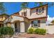 Attractive home showcasing an arched entry, stone accents, and well-maintained landscaping for enhanced curb appeal at 2435 N Riley Rd, Buckeye, AZ 85396