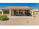 Covered back patio with seating area, perfect for outdoor dining and relaxation at 26270 W Horsham Ct, Buckeye, AZ 85396