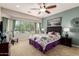 Charming bedroom with a large window, comfortable bed, and stylish decor at 26270 W Horsham Ct, Buckeye, AZ 85396