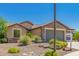 Beautiful home featuring stone accents, desert landscaping, and a well-maintained front yard, great curb appeal at 26270 W Horsham Ct, Buckeye, AZ 85396