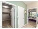 Hallway view of a walk-in closet and a bedroom at 26270 W Horsham Ct, Buckeye, AZ 85396