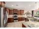 Gourmet kitchen featuring stainless steel appliances, ample counter space, and stylish cabinetry at 26270 W Horsham Ct, Buckeye, AZ 85396