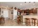 Kitchen features sleek stainless steel appliances, ample counter space, and a convenient breakfast bar at 26270 W Horsham Ct, Buckeye, AZ 85396