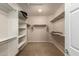 Spacious walk-in closet with custom shelving and ample storage space at 26270 W Horsham Ct, Buckeye, AZ 85396