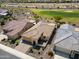 Beautiful desert home with a tile roof, lush landscaping, and a three car garage at 26421 W Zachary Dr, Buckeye, AZ 85396