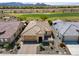 Beautiful desert home with a tile roof, lush landscaping, and a three car garage at 26421 W Zachary Dr, Buckeye, AZ 85396