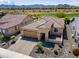 Beautiful aerial view of a home featuring manicured desert landscaping and a tiled roof at 26421 W Zachary Dr, Buckeye, AZ 85396