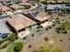 An aerial view shows homes in a neighborhood that feature owned solar panels and backyard patios at 26421 W Zachary Dr, Buckeye, AZ 85396