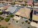 A high aerial view shows a residence with low-maintenance landscaping and backyard entertainment area at 26421 W Zachary Dr, Buckeye, AZ 85396