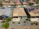 Lush backyard with a putting green, desert landscaping, and a covered patio, creating a serene outdoor retreat at 26421 W Zachary Dr, Buckeye, AZ 85396
