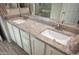 Double vanity in a bathroom with granite counters at 26421 W Zachary Dr, Buckeye, AZ 85396