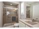 This bathroom features a shower, a toilet, a sink with drawers, and a towel bar at 26421 W Zachary Dr, Buckeye, AZ 85396