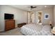 Bedroom with an ensuite bathroom and modern furnishings at 26421 W Zachary Dr, Buckeye, AZ 85396