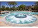 Luxurious community pool and spa area with ample seating and resort-style amenities at 26421 W Zachary Dr, Buckeye, AZ 85396