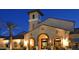 Stunning clubhouse exterior with unique architecture and well-maintained landscaping at 26421 W Zachary Dr, Buckeye, AZ 85396