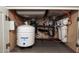 Under-sink view shows modern plumbing with a reverse osmosis water filtration system installed at 26421 W Zachary Dr, Buckeye, AZ 85396